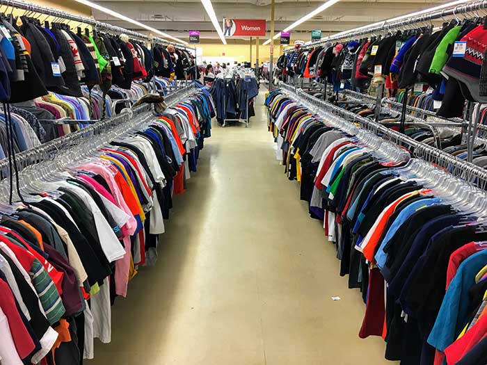 Rows of thrift store clothing
